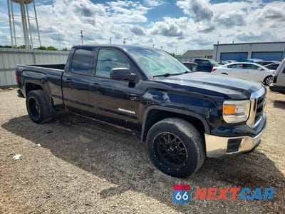 Czwarte zdjęcie samochodu z boku: 2014 GMC SIERRA K1500 VIN:1GTV2TEC5EZ360906 - miniatura