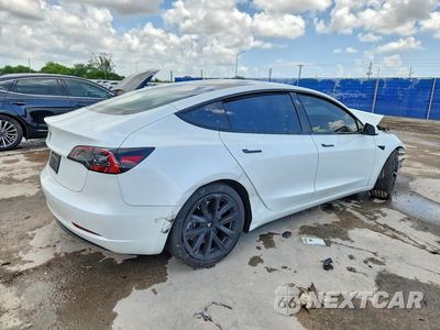 Trzecie zdjęcie samochodu z tyłu: 2023 TESLA MODEL 3 VIN:5YJ3E1EAXPF502807 - miniatura