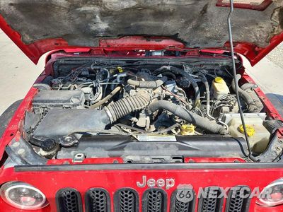 Zdjęcie 11 z 12 samochodu: 2011 JEEP WRANGLER UNLIMITED SAHARA VIN:1J4HA5H1XBL534497 - miniatura