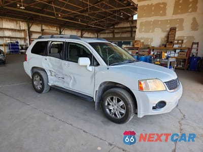 Czwarte zdjęcie samochodu z boku: 2011 MITSUBISHI ENDEAVOR LS VIN:4A4JM2ASXBE016225 - miniatura