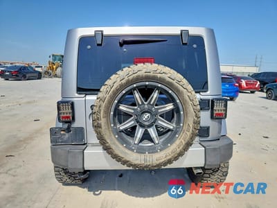 Zdjęcie 6 z 14 samochodu: 2015 JEEP WRANGLER UNLIMITED SAHARA VIN:1C4BJWEG0FL563913 - miniatura