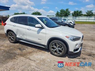 Czwarte zdjęcie samochodu z boku: 2016 BMW X1 XDRIVE28I VIN:WBXHT3C36G5E53463 - miniatura