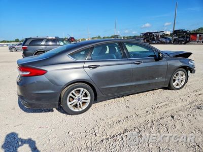 Trzecie zdjęcie samochodu z tyłu: 2018 FORD FUSION SE HYBRID VIN:3FA6P0LU7JR169282 - miniatura
