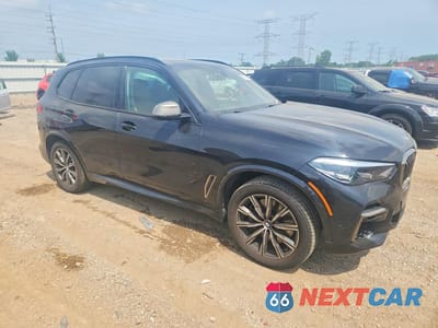 Czwarte zdjęcie samochodu z boku: 2022 BMW X5 M50I VIN:5UXJU4C03N9K58008 - miniatura