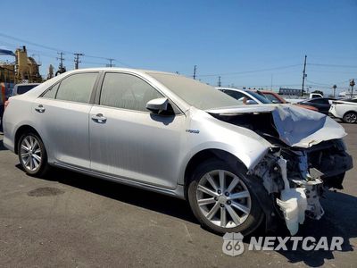 Czwarte zdjęcie samochodu z boku: 2012 TOYOTA CAMRY HYBRID XLE VIN:4T1BD1FKXCU003184 - miniatura