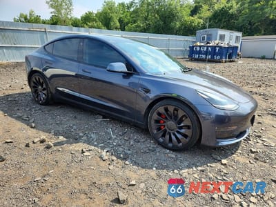 Czwarte zdjęcie samochodu z boku: 2021 TESLA MODEL 3 VIN:5YJ3E1EC3MF064810 - miniatura