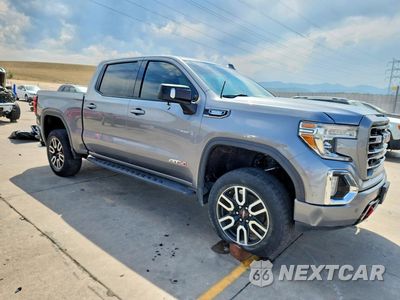 Czwarte zdjęcie samochodu z boku: 2021 GMC SIERRA K1500 AT4 VIN:1GTU9EET2MZ174984 - miniatura