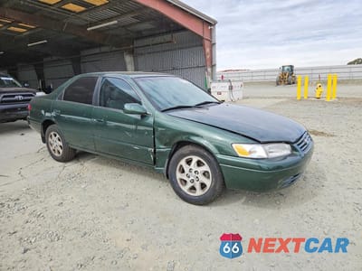 Czwarte zdjęcie samochodu z boku: 1999 TOYOTA CAMRY LE V6 VIN:JT2BF22K1X0181601 - miniatura