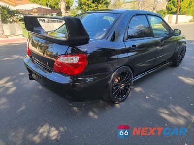 Czwarte zdjęcie samochodu z boku: 2004 SUBARU IMPREZA WRX STI VIN:JF1GD70694L521776 - miniatura