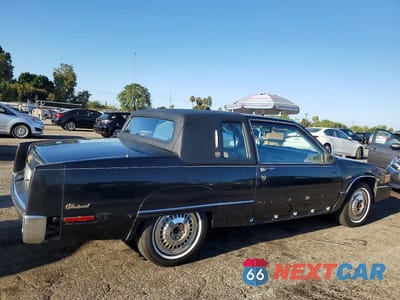 Trzecie zdjęcie samochodu z tyłu: 1990 CADILLAC FLEETWOOD VIN:1G6CB1330L4206115 - miniatura