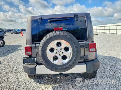 Zdjęcie 6 z 13 samochodu: 2014 JEEP WRANGLER UNLIMITED SAHARA VIN:1C4BJWEG0EL299865 - miniatura