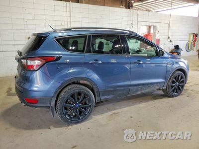 Trzecie zdjęcie samochodu z tyłu: 2018 FORD ESCAPE SE VIN:1FMCU9GD0JUA72093 - miniatura