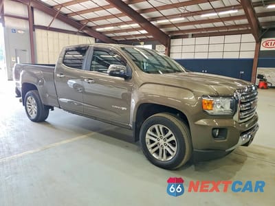 Czwarte zdjęcie samochodu z boku: 2016 GMC CANYON SLT VIN:1GTP6DE10G1325113 - miniatura