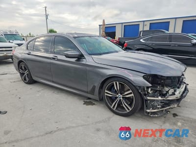 Czwarte zdjęcie samochodu z boku: 2018 BMW 750 I VIN:WBA7F0C59JGM23072 - miniatura