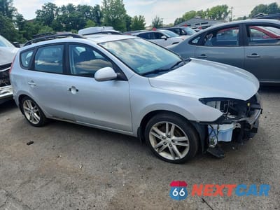 Czwarte zdjęcie samochodu z boku: 2010 HYUNDAI ELANTRA TOURING SE VIN:KMHDC8AE1AU077497 - miniatura