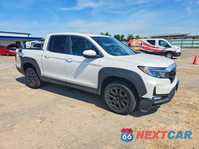 Czwarte zdjęcie samochodu z boku: 2023 HONDA RIDGELINE RTL VIN:5FPYK3F5XPB029042 - miniatura