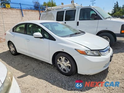 Czwarte zdjęcie samochodu z boku: 2012 HONDA CIVIC HYBRID VIN:JHMFB4F24CS000062 - miniatura