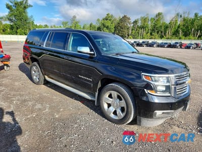Czwarte zdjęcie samochodu z boku: 2015 CHEVROLET SUBURBAN K1500 LTZ VIN:1GNSKKKC4FR123012 - miniatura