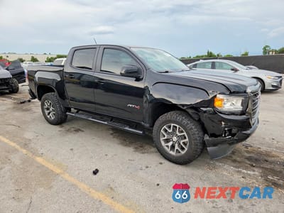Czwarte zdjęcie samochodu z boku: 2022 GMC CANYON AT4 VIN:1GTG6FEN1N1327917 - miniatura