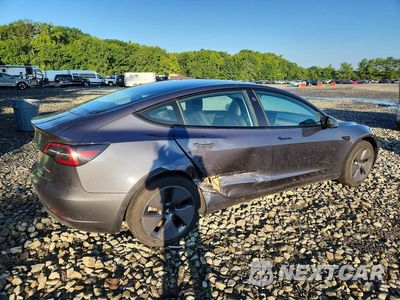 Trzecie zdjęcie samochodu z tyłu: 2023 TESLA MODEL 3 VIN:5YJ3E1EB3PF634431 - miniatura