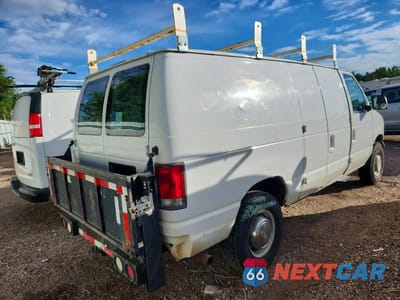 Trzecie zdjęcie samochodu z tyłu: 1999 FORD ECONOLINE E350 SUPER DUTY VAN VIN:1FTSE34L4XHA33918 - miniatura