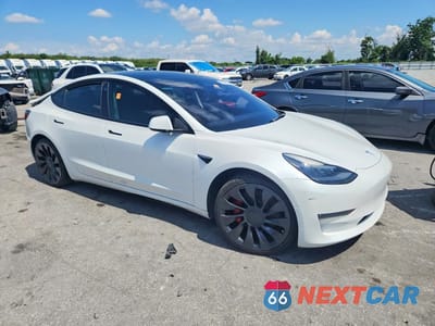Czwarte zdjęcie samochodu z boku: 2021 TESLA MODEL 3 VIN:5YJ3E1ECXMF088456 - miniatura