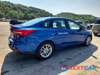 Trzecie zdjęcie samochodu z tyłu: 2018 FORD FOCUS SE VIN:1FADP3F28JL233847 - miniatura