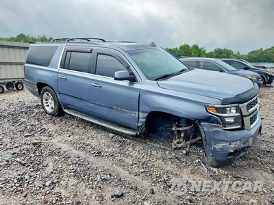 Czwarte zdjęcie samochodu z boku: 2016 CHEVROLET SUBURBAN C1500 LT VIN:1GNSCHKC2GR256126 - miniatura
