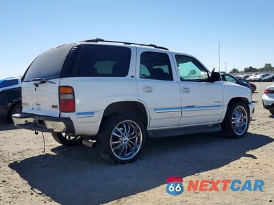 Trzecie zdjęcie samochodu z tyłu: 2002 GMC YUKON VIN:1GKEC13T42R131783 - miniatura