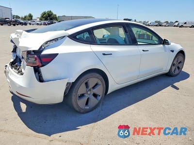 Trzecie zdjęcie samochodu z tyłu: 2023 TESLA MODEL 3 VIN:5YJ3E1EA3PF383417 - miniatura