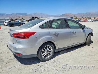 Trzecie zdjęcie samochodu z tyłu: 2016 FORD FOCUS SE VIN:1FADP3F27GL286497 - miniatura