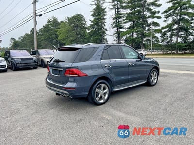 Czwarte zdjęcie samochodu z boku: 2016 MERCEDES-BENZ GLE 550E 4MATIC VIN:4JGDA6DB3GA598873 - miniatura