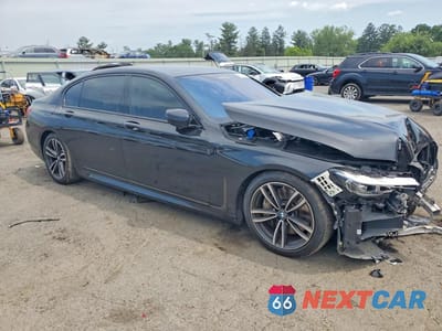 Czwarte zdjęcie samochodu z boku: 2022 BMW 750 XI VIN:WBA7U2C02NCJ34070 - miniatura