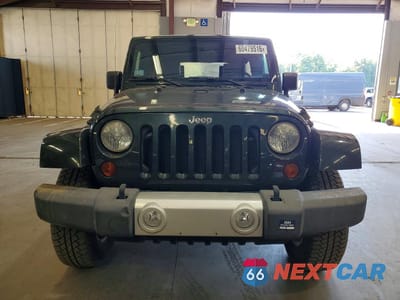 Piąte zdjęcie samochodu w środku: 2010 JEEP WRANGLER UNLIMITED SAHARA VIN:1J4BA5H17AL167899 - miniatura