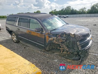 Czwarte zdjęcie samochodu z boku: 2015 CHEVROLET SUBURBAN C1500 LT VIN:1GNSCJKC6FR604189 - miniatura