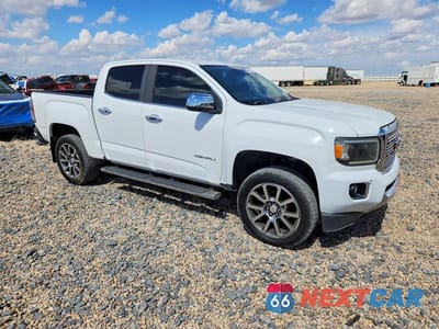 Czwarte zdjęcie samochodu z boku: 2018 GMC CANYON DENALI VIN:1GTG6EEN8J1310911 - miniatura
