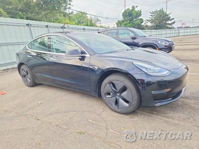 Czwarte zdjęcie samochodu z boku: 2019 TESLA MODEL 3 VIN:5YJ3E1EA8KF304638 - miniatura