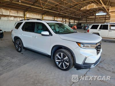 Czwarte zdjęcie samochodu z boku: 2025 HONDA PILOT TOURING VIN:5FNYG1H79SB167077 - miniatura