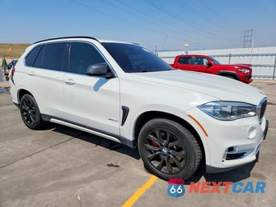 Czwarte zdjęcie samochodu z boku: 2014 BMW X5 XDRIVE50I VIN:5UXKR6C51E0C02248 - miniatura