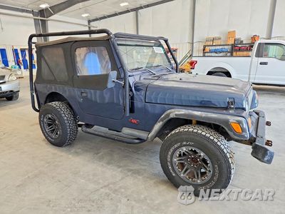 Czwarte zdjęcie samochodu z boku: 1997 JEEP WRANGLER / TJ SE VIN:1J4FY29P1VP545907 - miniatura