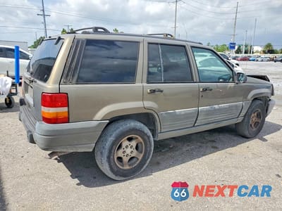 Trzecie zdjęcie samochodu z tyłu: 1997 JEEP GRAND CHEROKEE LAREDO VIN:1J4FX58S9VC726870 - miniatura