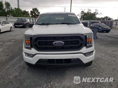 Piąte zdjęcie samochodu w środku: 2021 FORD F150 SUPERCREW VIN:1FTFW1CD1MFC92323 - miniatura