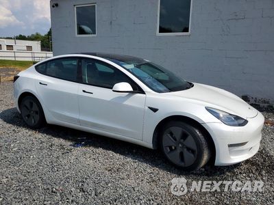 Czwarte zdjęcie samochodu z boku: 2021 TESLA MODEL 3 VIN:5YJ3E1EBXMF035604 - miniatura