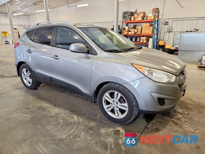 Czwarte zdjęcie samochodu z boku: 2011 HYUNDAI TUCSON GLS VIN:KM8JU3AC0BU293022 - miniatura
