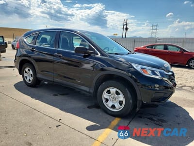 Czwarte zdjęcie samochodu z boku: 2016 HONDA CR-V LX VIN:5J6RM4H35GL003058 - miniatura