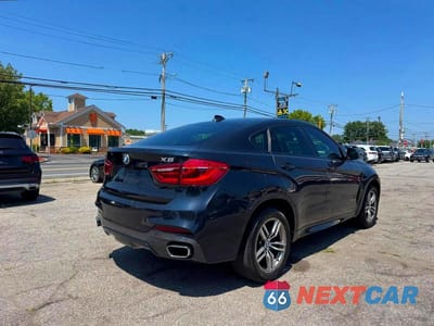 Czwarte zdjęcie samochodu z boku: 2018 BMW X6 SDRIVE35I VIN:5UXKU0C51J0G80952 - miniatura