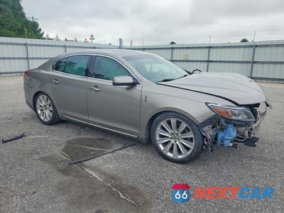 Czwarte zdjęcie samochodu z boku: 2015 LINCOLN MKS VIN:1LNHL9FT7FG607914 - miniatura