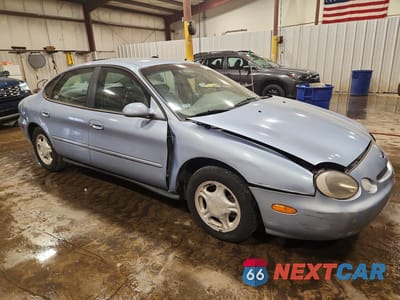 Czwarte zdjęcie samochodu z boku: 1997 FORD TAURUS GL VIN:1FALP52U4VA237474 - miniatura