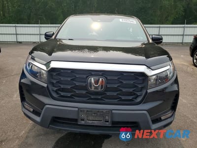 Piąte zdjęcie samochodu w środku: 2023 HONDA PASSPORT EXL VIN:5FNYF8H56PB039946 - miniatura