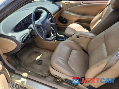 Zdjęcie 7 z 12 samochodu: 1999 CHRYSLER SEBRING JX VIN:3C3EL45H4XT538432 - miniatura